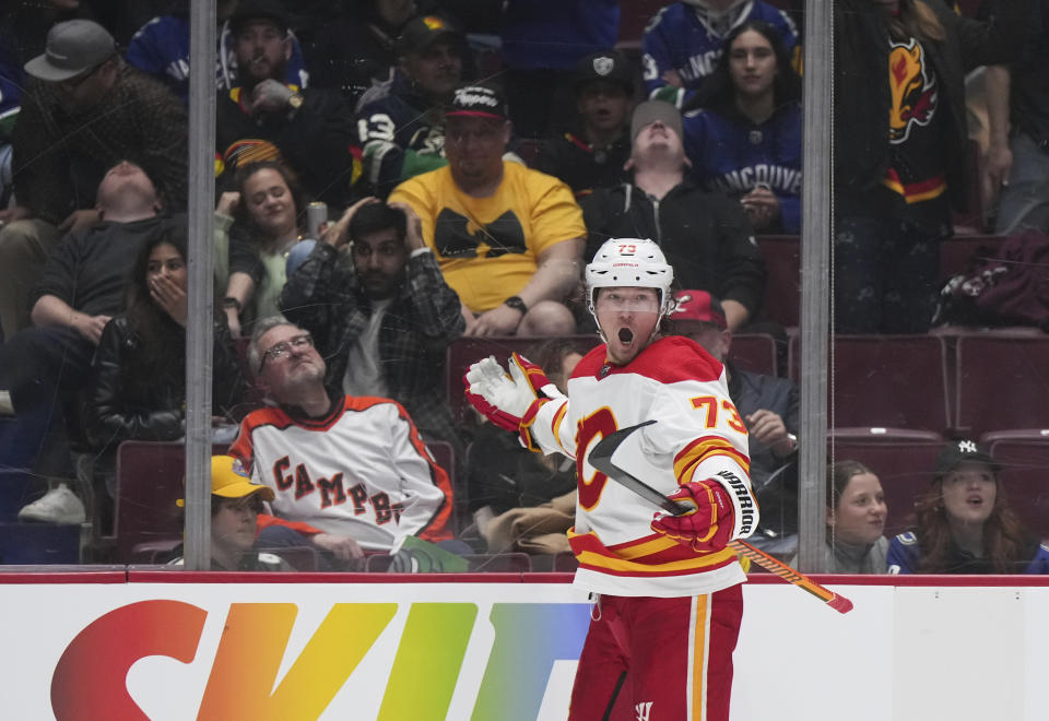 Calgary Flames' Tyler Toffoli celebrates after scoring against the Vancouver Canucks during overtime in an NHL hockey game Friday, March 31, 2023, in Vancouver, British Columbia. (Darryl Dyck/The Canadian Press via AP)