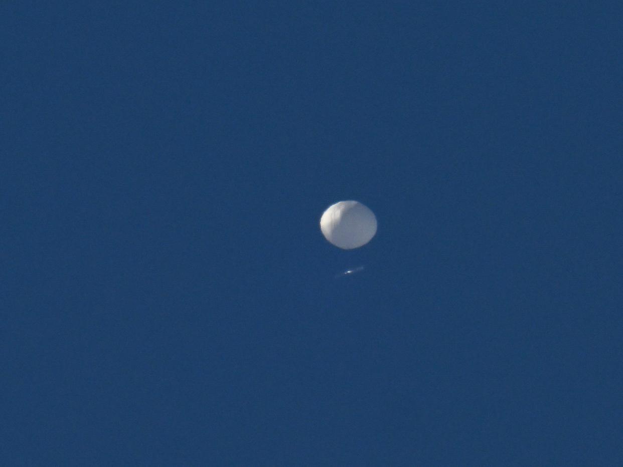 A Chineses surveillance balloon flies above in Charlotte, North Carolina, on February 4, 2023.