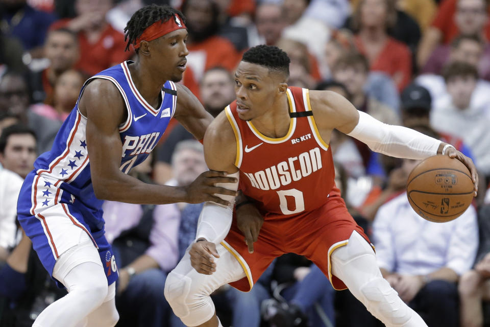 Houston Rockets guard Russell Westbrook (0) dribbles as Philadelphia 76ers guard Josh Richardson defends during the second half of an NBA basketball game Friday, Jan. 3, 2020, in Houston. (AP Photo/Eric Christian Smith)