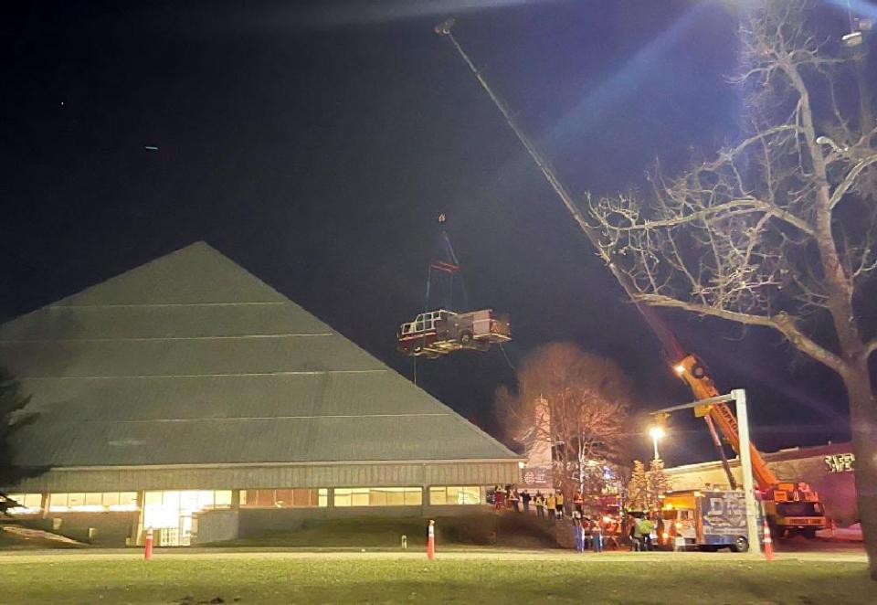 A photo of Engine 23 being lifted into Fish Creek Library by crane taken on April 22, 2023. 