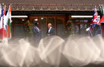 German Chancellor Olaf Scholz, right, greets Sengal's President Macky Sall during the official welcome ceremony of G7 leaders and Outreach guests at Castle Elmau in Kruen, near Garmisch-Partenkirchen, Germany, on Monday, June 27, 2022. The Group of Seven leading economic powers are meeting in Germany for their annual gathering Sunday through Tuesday. (AP Photo/Markus Schreiber)