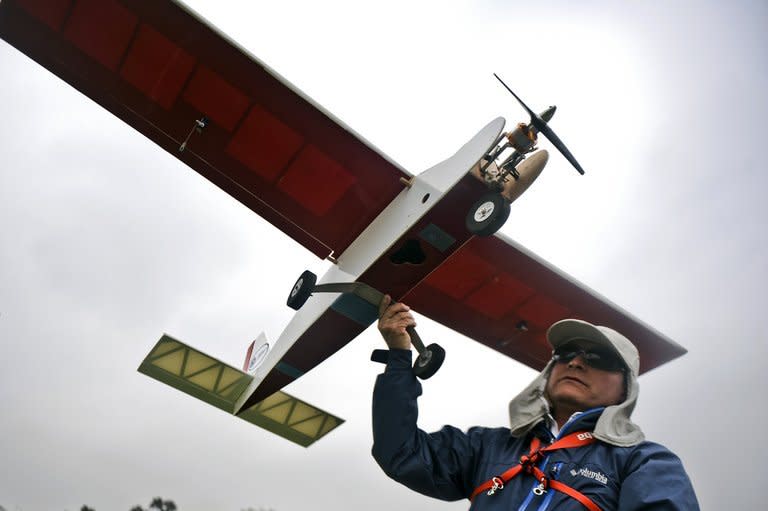 A man prepares to launch a drone in Lima, Peru on July 10, 2013. Drones are being used to help map the 1,300 year-old Moche civilization around San Idelfonso and San Jose del Moro, two sites on the Peruvian coast north of Lima