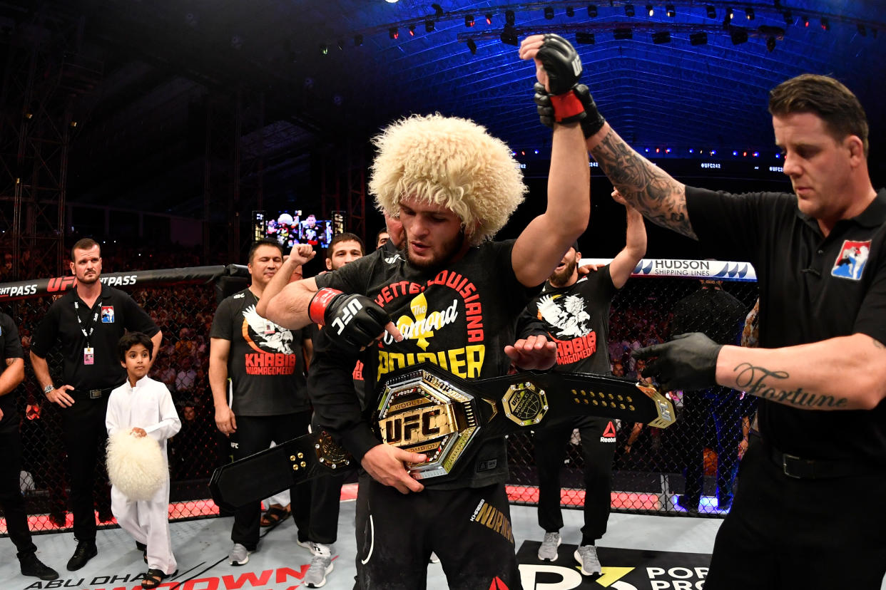 ABU DHABI, UNITED ARAB EMIRATES - SEPTEMBER 07:  Khabib Nurmagomedov of Russia celebrates his submission victory over Dustin Poirier in their lightweight championship bout during UFC 242 at The Arena on September 7, 2019 in Yas Island, Abu Dhabi, United Arab Emirates. (Photo by Jeff Bottari/Zuffa LLC/Zuffa LLC via Getty Images)