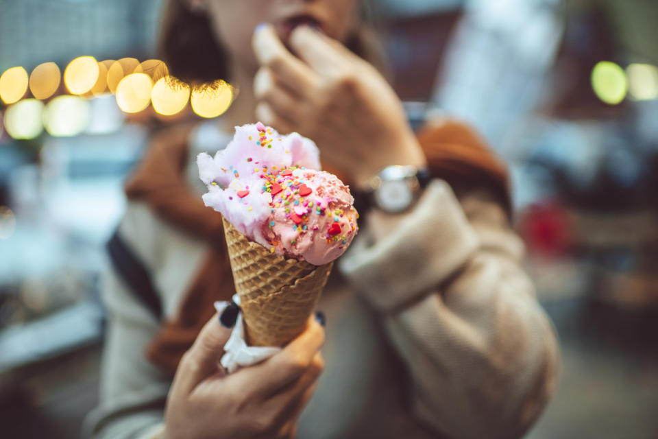 A teenager eating an ice cream