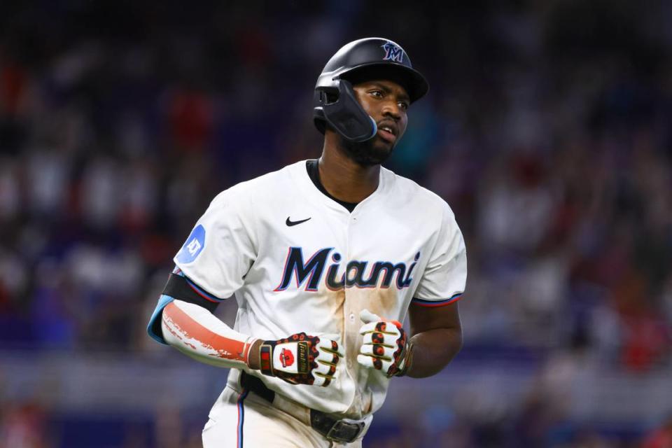 Jul 4, 2024; Miami, Florida, USA; Miami Marlins right fielder Jesus Sanchez (12) circles the bases after hitting a two-run home run against the Boston Red Sox during the eleventh inning at loanDepot Park.