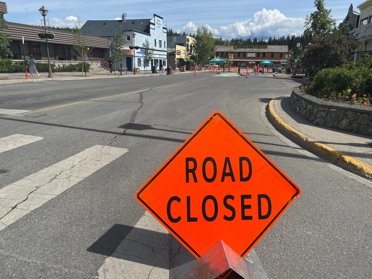 Reviews have been mixed on the City of Whitehorse's town square pilot project. Since June, a block of Main Street downtown has been closed to vehicle traffic. The pilot project ends on Tuesday. (George Maratos/CBC - image credit)