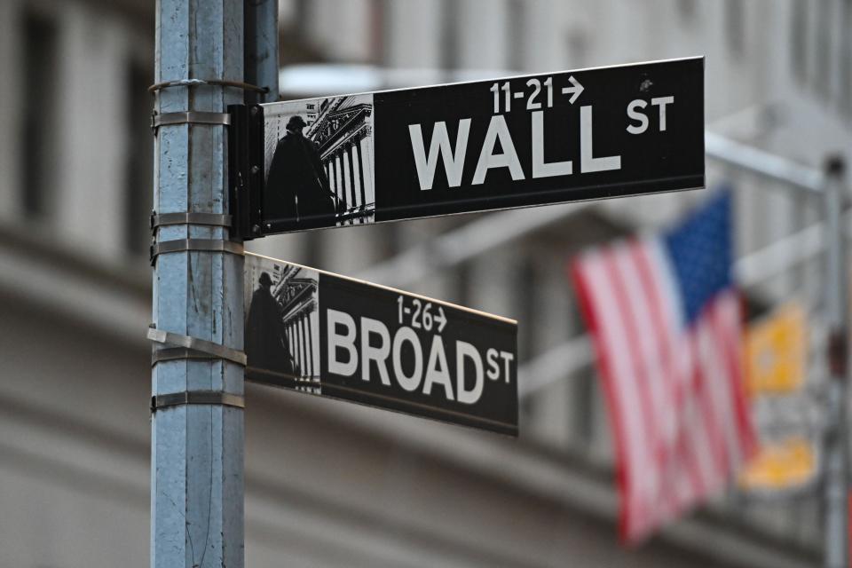 American Flags outside the New York Stock Exchange (NYSE). Wall Street stocks were up, as well as the FTSE