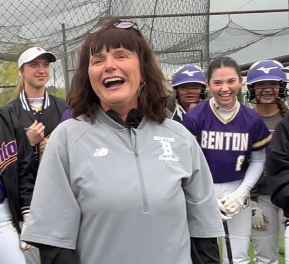 Benton softball coach Tracey Rambin laughs with her team after finding out she's an LSCA Hall of Fame selectee.