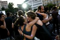 People celebrate at Klafthmonos Square in Athens on July 5, 2015