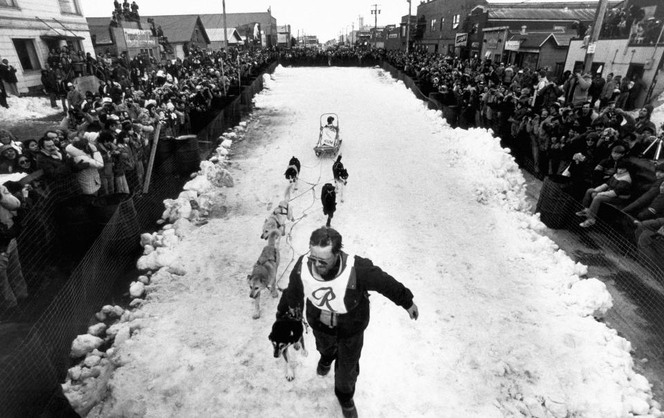 FILE - Rick Swenson leads his team the final few yards to win the ninth annual Iditarod Sled Dog Race in Nome, Alaska, March 19, 1981. Dallas Seavey is tied with Swenson for the most Iditarod victories ever at five, and Seavey is looking for his sixth title when the 2022 Iditarod Trail Sled Dog Race starts this Saturday, March 5, 2022, in Alaska. (AP Photo/File)