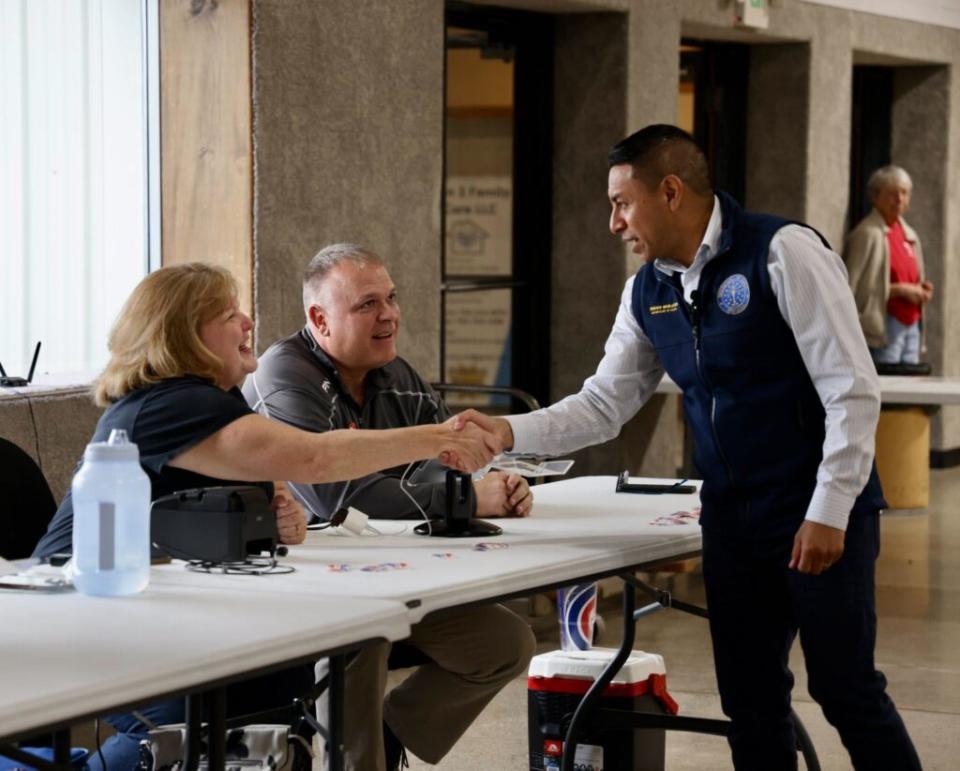  Indiana Secretary of State Diego Morales shakes hands with Tipton County election workers in a photo posted on May 7, 2024 — Primary Election Day. (From SOS’ X account)