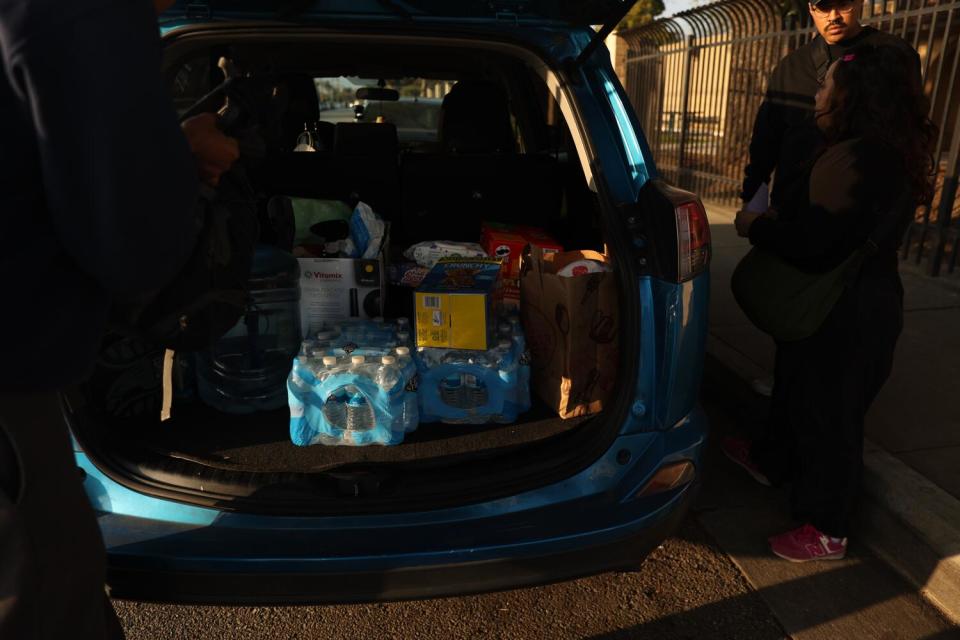 Supplies for Cal State LA encampment members are placed in the back of a van.