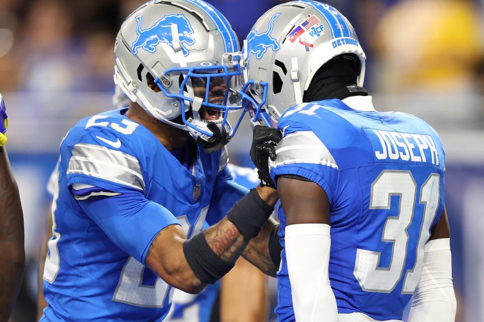 DETROIT, MICHIGAN - SEPTEMBER 08: Kerby Joseph #31 of the Detroit Lions celebrates after an interception of Matthew Stafford #9 of the Los Angeles Rams in the end zone with Carlton Davis III at Ford Field on September 08, 2024 in Detroit, Michigan. (Photo by Gregory Shamus/Getty Images)