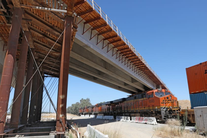 MADERA, CA - AUGUST 05: A 700 foot bullet train bridge across Road 27, between Road 27 and Club Dr., and the BNSF main line in Madera County had a serious problem with corroded tension strands that broke in December 2019, on Wednesday, Aug. 5, 2020 in Madera, CA. The California High-Speed Rail Authority is making repairs, though the incident points to seriously underlying problems in the project's management. After the strands (steel cables) broke, construction teams shored up the bridge with falsework. (Gary Coronado / Los Angeles Times)