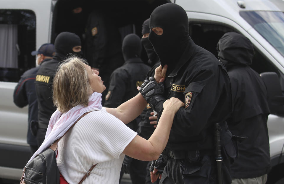 A woman argues with a policeman during a protest in Minsk, Belarus, Tuesday, Sept. 1, 2020. Several hundred students on Tuesday gathered in Minsk and marched through the city center, demanding the resignation of the country's authoritarian leader after an election the opposition denounced as rigged. Many have been detained as police moved to break up the crowds. (Tut.By via AP)