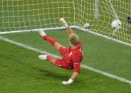 English goalkeeper Joe Hart watches the ball in his net scored by Italian midfielder Alessandro Diamanti during the penalty shoot-out at the Olympic Stadium in Kiev. England's penalty curse struck again here Sunday as Italy advanced to the semi-finals of Euro 2012 with victory in a shoot-out after a tense quarter-final duel finished 0-0 following extra-time