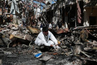 <p>A forensic expert inspects a destroyed funeral hall two days after a deadly Saudi-led airstrike targeted it, in Sanaa, Yemen, Monday, Oct. 10, 2016. (AP Photo/Hani Mohammed)</p>