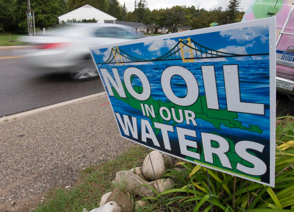 A sign opposing Enbridge's pipeline under the Straits of Mackinac is shown Tuesday, September 27, 2016 in St. Ignace, Michigan. Environmental groups and tribes across the region say that the Line 5 pipeline is one of the biggest threats to the Great Lakes.