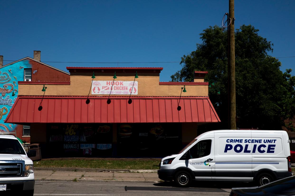 A Cincinnati Crime Scene Unit parks outside the Hook Fish & Chicken restaurant while investigating a fatal shooting that happened behind the restaurant in West End on Thursday, June 30, 2022. 