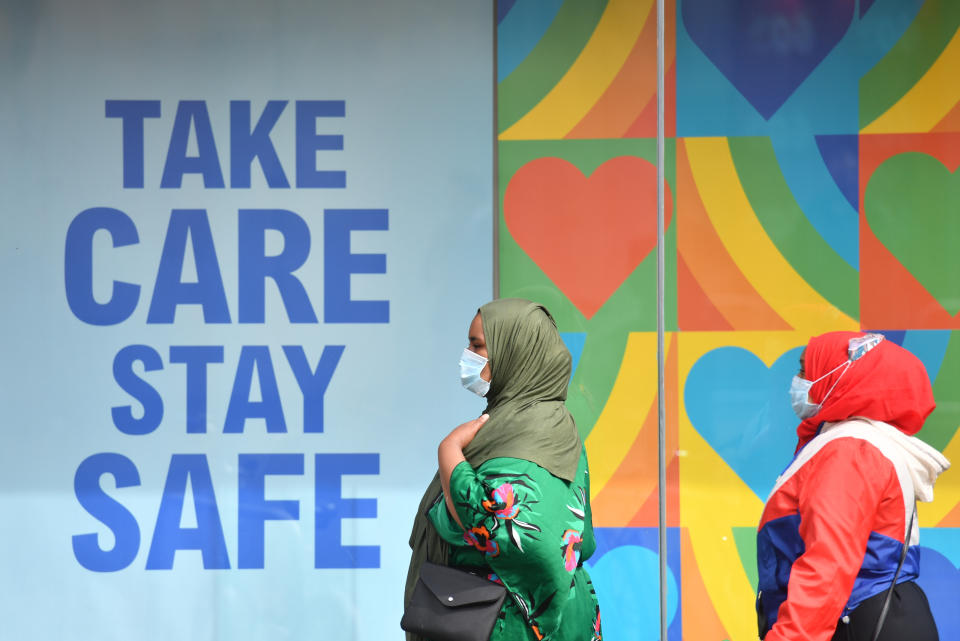 People wearing masks in Leicester city centre as face coverings become mandatory in shops and supermarkets in England.