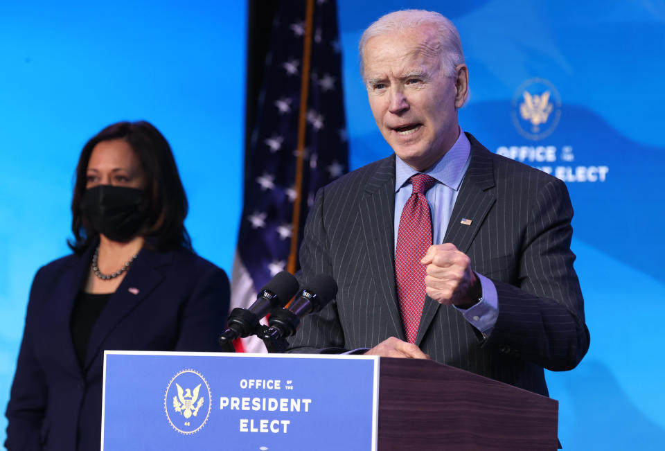 WILMINGTON, DELAWARE - JANUARY 08: U.S. Vice President-elect Kamala Harris (L) looks on as U.S. President-elect Joe Biden (R) delivers remarks after he announced cabinet nominees that will round out his economic team, including secretaries of commerce and labor, at The Queen theater on January 08, 2021 in Wilmington, Delaware. Biden announced he is nominating Rhode Island Gov. Gina Raimondo as his commerce secretary, Boston Mayor Martin J. Walsh his labor secretary and Isabel Guzman, a former Obama administration official, as head of the Small Business Administration. (Photo by Chip Somodevilla/Getty Images)