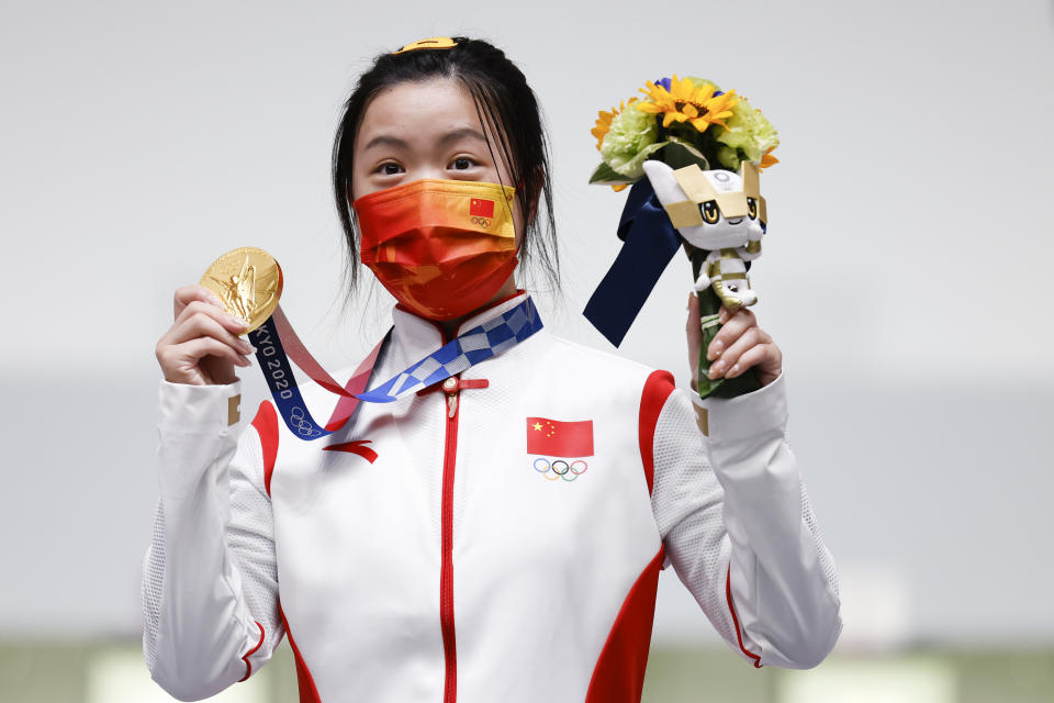 Yang Qian of China poses with gold medal