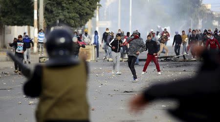 Protesters throw rocks toward police in Kasserine, Tunisia January 20, 2016. REUTERS/Amine Ben Aziza