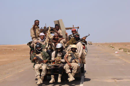 Members of the Yemeni army ride on the back of a military truck near the Red Sea coast city of al-Mokha, Yemen January 23, 2017. REUTERS/Fawaz Salman