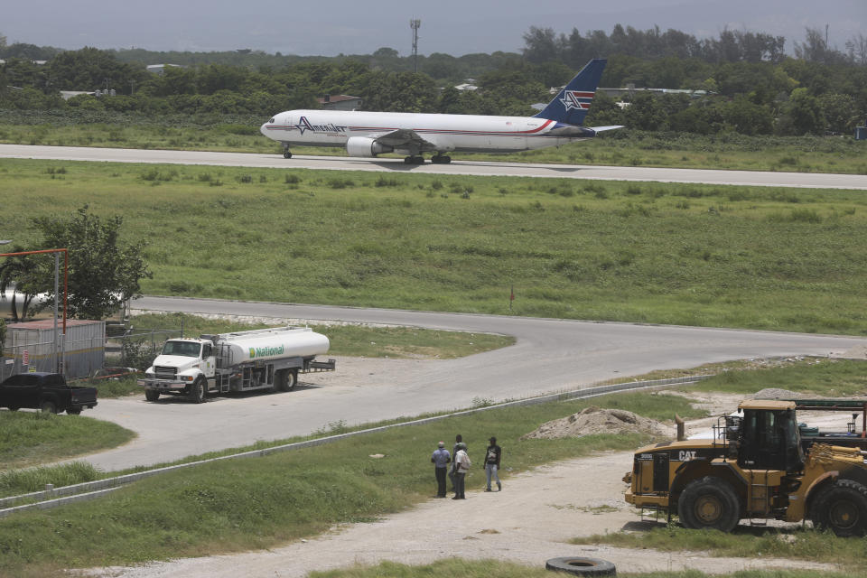 An Amerijet plane taxis on the runway after landing at the Toussaint Louverture International Airport in Port-au-Prince, Haiti, Monday, May 20, 2024. Haiti's main international airport reopened Monday for the first time in nearly three months after gang violence forced authorities to close it in early March. (AP Photo/Odelyn Joseph)