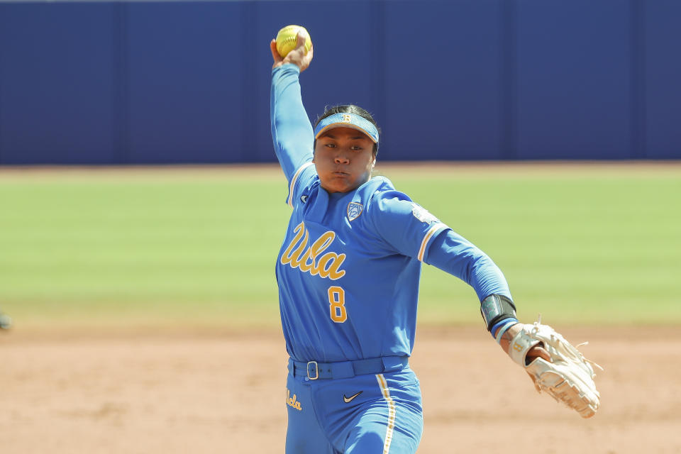 FILE - UCLA's Megan Faraimo pitches in the first inning of an NCAA softball Women's College World Series game against Oklahoma, in Oklahoma City on June 6, 1992. UCLA, which beat Oklahoma for the title in 2019 and reached the semifinals last season, is ready to challenge. Faraimo is one of the nation’s best pitchers, and the Bruins have the bats to back her up. (AP Photo/Alonzo Adams, File)