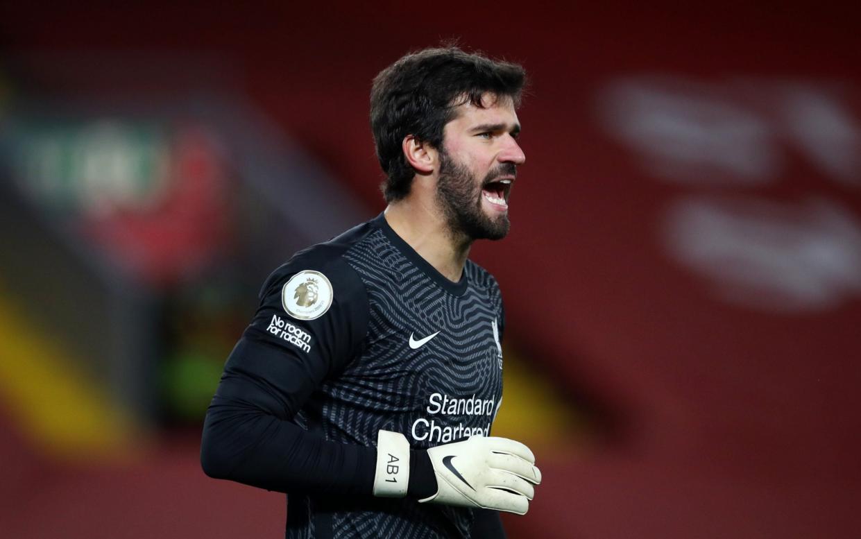 Alisson Becker of Liverpool gives his team instructions during the Premier League match between Liverpool and Sheffield United at Anfield on October 24, 2020 in Liverpool, England.  - GETTY IMAGES