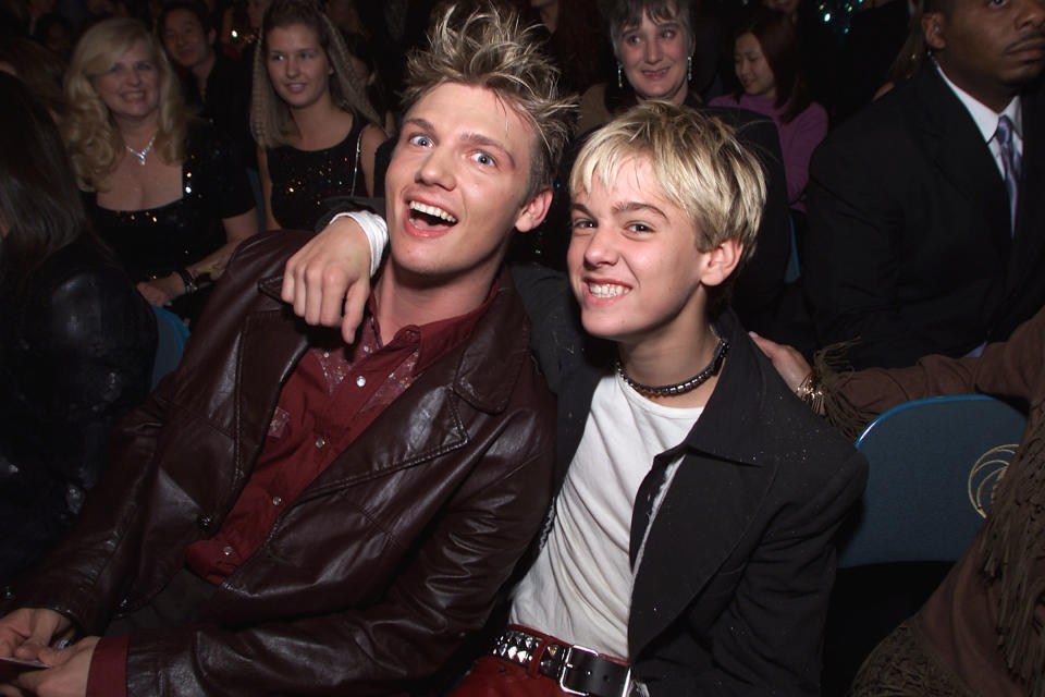 Nick and Aaron Carter in the audience during the 2000 Billboard Music Awards in Las Vegas