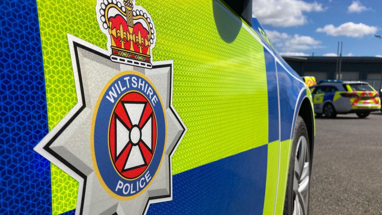 A close up of the side of a Wiltshire police car