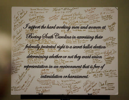 A sign with signatures of support is displayed at a rally held by The International Association of Machinists and Aerospace Workers for Boeing South Carolina workers before Wednesday's vote to organize, in North Charleston, South Carolina, U.S. February 13, 2017. REUTERS/Randall Hill