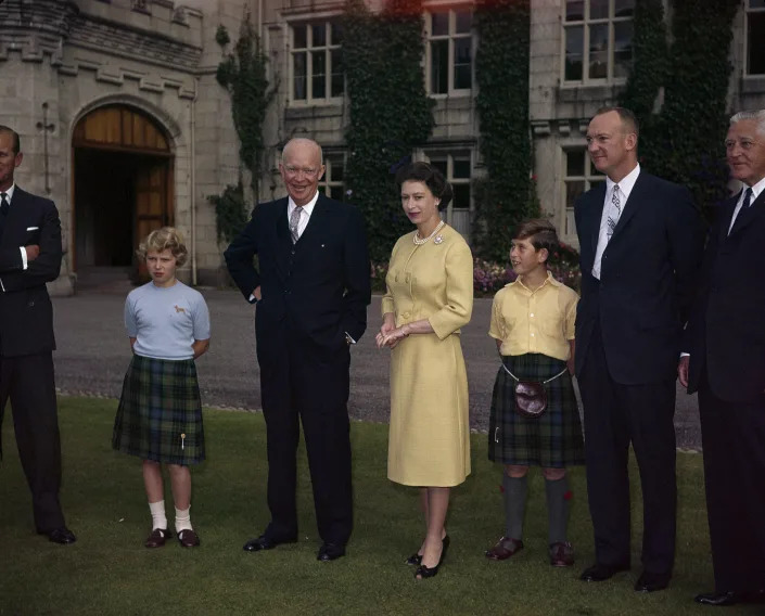 Queen Elizabeth II on the grounds of Balmoral Castle, surrounded by her family, with President Dwight D. Eisenhower on Aug. 29, 1959. 