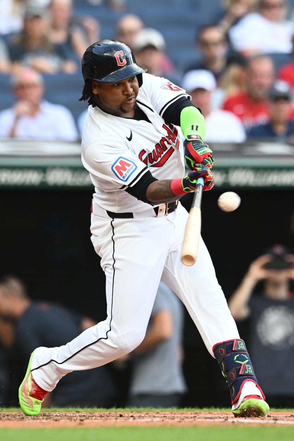 Aug 1, 2024; Cleveland, Ohio, USA; Cleveland Guardians third baseman Jose Ramirez (11) hits a sacrifice fly during the first inning against the Baltimore Orioles at Progressive Field. Mandatory Credit: Ken Blaze-USA TODAY Sports