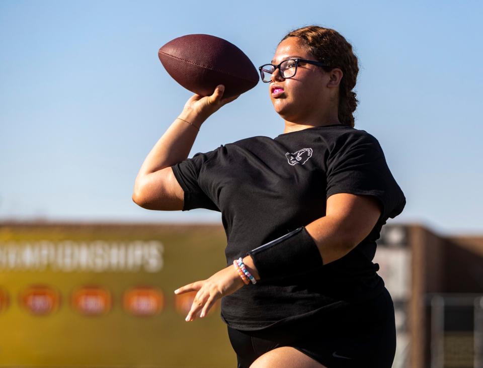 Quarterback Isabella Gonzalez looks to pass during practice at Palm Desert High School in Palm Desert, Calif., Thursday, Sept. 14, 2023.