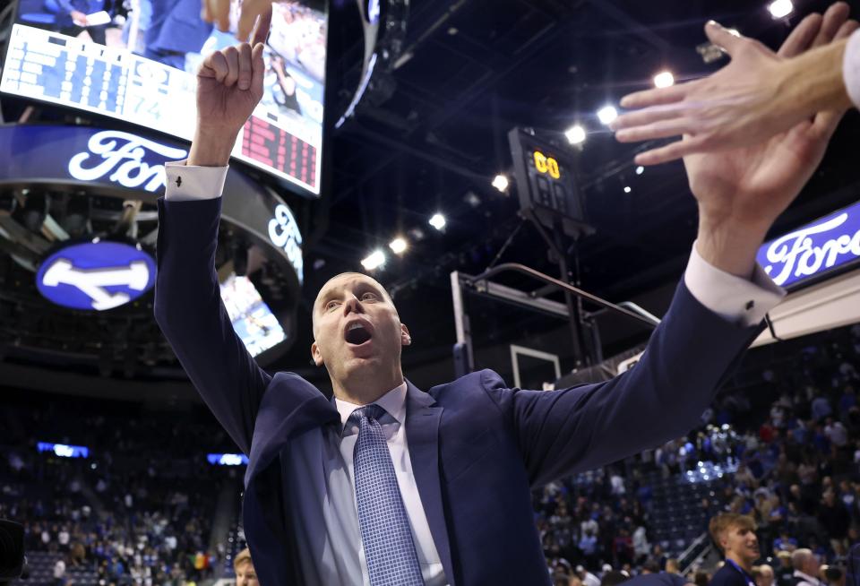 BYU basketball coach Mark Pope celebrates with fans after BYU’s win against San Diego State at BYU’s Marriott Center in Provo on Friday, Nov. 10, 2023. | Laura Seitz, Deseret News