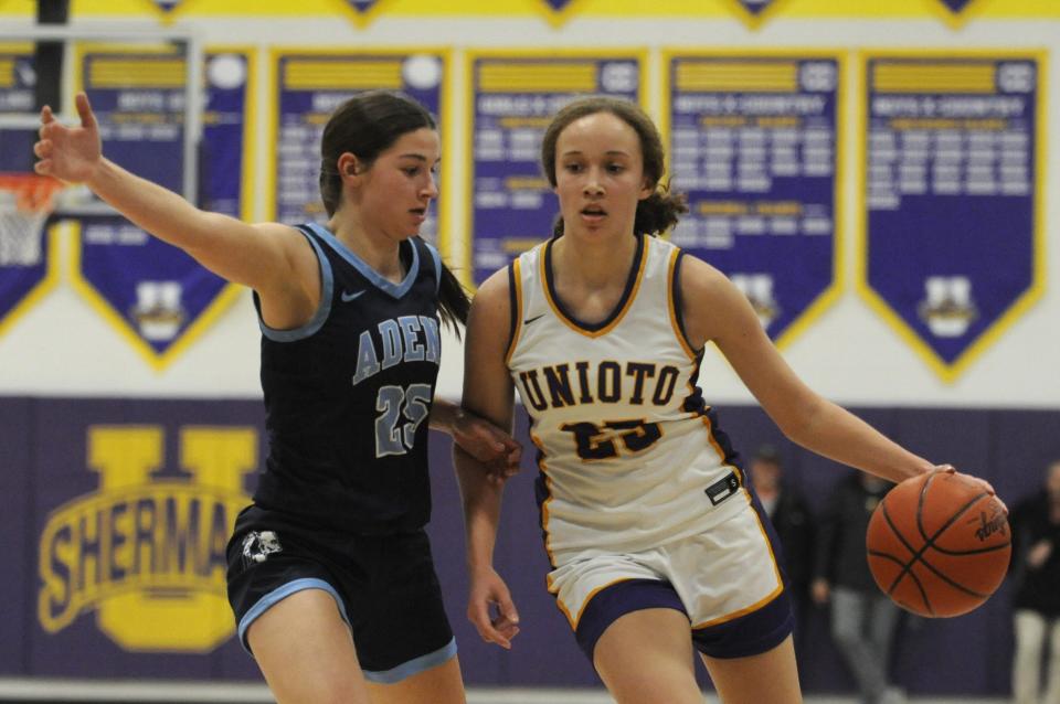Unioto's Milee Smith (right) drives toward the basket as Adena's Sydney Ater (left) defends during the Shermans' 63-49 win over the Warriors at Unioto High School on Jan. 30, 2024, in Chillicothe, Ohio.
