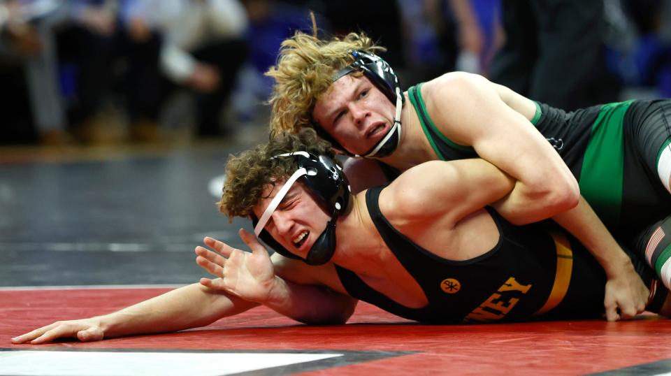 Camden Catholic's Wayne Rold looks to turn St. John Vianney's Anthony Paulino in the 138-pound bout on Sunday. Rold won 9-1, clinching the state Non-Public B title for the Irish.