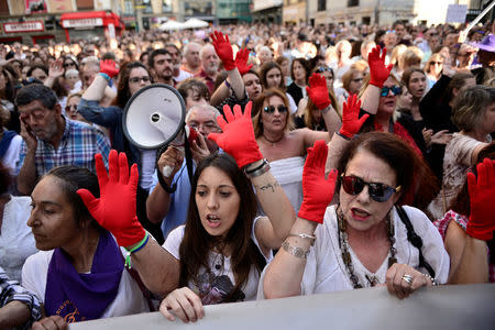 People protest the provisional release granted to five men cleared of the gang rape of a teenager and convicted of a lesser crime of sexual abuse in Pamplona, Spain, June 22, 2018. REUTERS/Vincent West