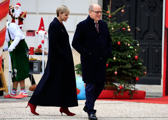 <p>VALERY HACHE/POOL/AFP via Getty</p> Prince Albert and Princess Charlene of Monaco at Prince's Palace of Monaco on Dec. 20.