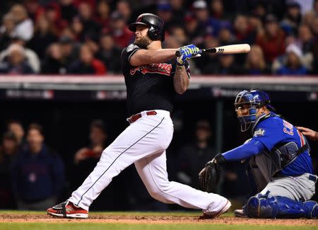 Oct 26, 2016; Cleveland, OH, USA; Cleveland Indians first baseman Mike Napoli hits a single against the Chicago Cubs in the 6th inning in game two of the 2016 World Series at Progressive Field. Mandatory Credit: Ken Blaze-USA TODAY Sports