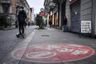 A street in downtown Milan's Chinese neighborhood Tuesday, Feb. 25, 2020. Civil protection officials on Tuesday reported a large jump of Coronavirus cases in Italy, from 222 to 283. Seven people have died, all of them elderly people suffering other pathologies. (Claudio Furlan/LaPresse via AP)