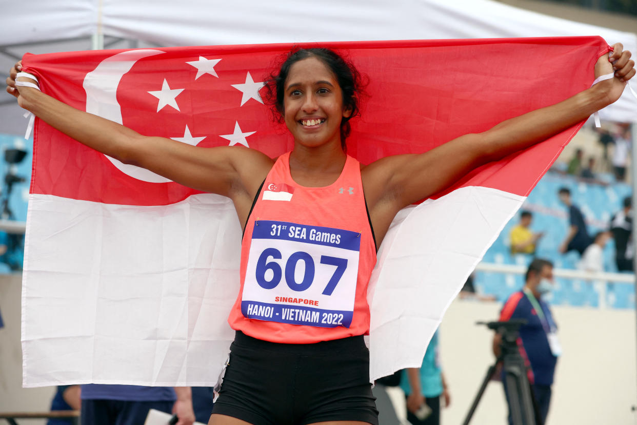 Singapore sprinter Shanti Pereira celebrates winning the women's 200m gold at the SEA Games in Hanoi in 2022. 