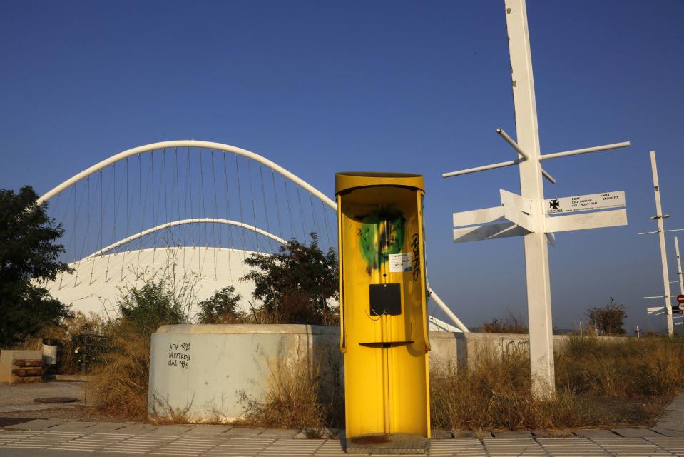 A vandalised phone booth is seen at the Athens 2004 Olympic Complex in Athens
