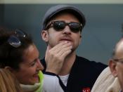 Singer/actor Justin Timberlake watches Rafael Nadal of Spain face Novak Djokovic of Serbia in the men's final match at the U.S. Open tennis championships in New York, September 9, 2013. REUTERS/Mike Segar (UNITED STATES - Tags: SPORT TENNIS ENTERTAINMENT)