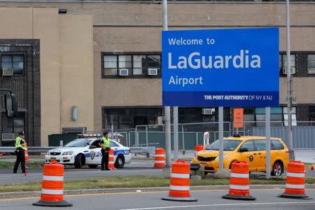 Port Authority Police monitor the entrance to LaGuardia Airport in the lead up to the holiday weekend in the Queens borough of New York, U.S., June 29, 2016. REUTERS/Andrew Kelly