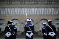 Navy soldiers awaiting French President Emmanuel Macron for a ceremony prior to his New Year's speech to the French Armed Forces at Brest naval training center, western France, Tuesday, Jan. 19, 2021. (Stephane Mahe/Pool Photo via AP)