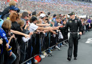 FORT WORTH, TX - NOVEMBER 06: Michael McDowell, driver of the #18 M&M's Toyota, greets fans during driver introductions prior to the start of the NASCAR Sprint Cup Series AAA Texas 500 at Texas Motor Speedway on November 6, 2011 in Fort Worth, Texas. (Photo by Jared C. Tilton/Getty Images for NASCAR)